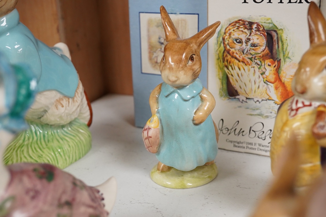 Nine Beswick Beatrix Potter figures, some stamped F. Warne & Co , largest 17cm high